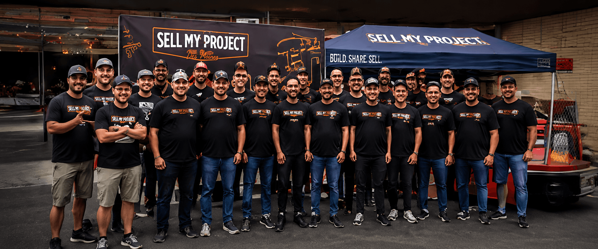 Builders at a Sell My Project event wearing SMP shirts